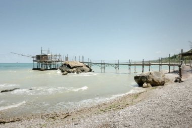 Trabocchi coast. View of the Trabocco Punta le Morge, Ancient fishing machine clipart