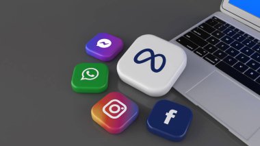 Facebook, Instagram, Whatsapp, Messenger ve meta logoların gri bir arka planda dizüstü bilgisayarda üç boyutlu yorumlanması.