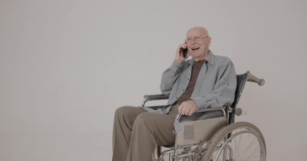 Happy Senior Man Using Smartphone Studio Setting — Stock Video