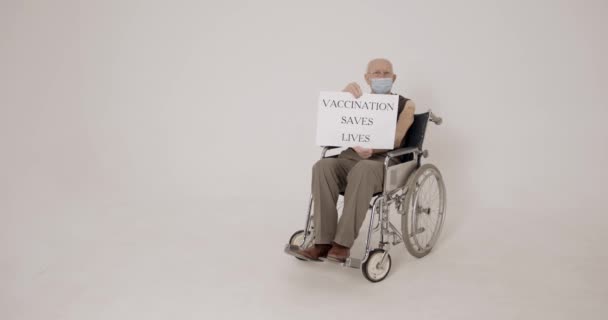 Elderly People Man Sitting Wheelchair Holding Board Vaccination Saves Lives — Stock Video
