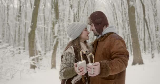 Kissing Couple Love Holding Cups Tea Chritmas Candies Outdoor Seasonal — Stock Video