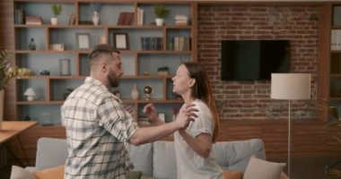 Couple fighting hard hitting each other at home closeup. 4K. Scandal and crisis in family. Domestic violence, abuse.