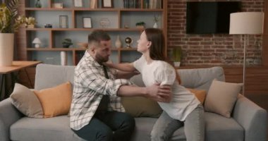 Couple fighting hard hitting each other at home closeup. 4K. Scandal and crisis in family. Domestic violence, abuse.