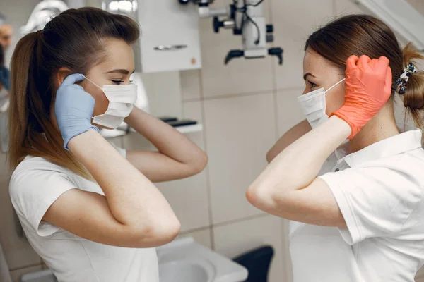 Doctors Special Uniform Dentists Wear Protective Masks Girls Look Each — Zdjęcie stockowe
