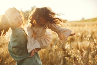 Family in a summer field. Sensual photo. Cute little girl.