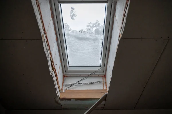 House insulation layers, styrofoam, polyurethane foam, wood, drywall around window