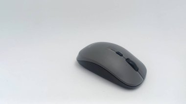 Jakarta, Indonesia - November 29, 2022: Isolated objects: The wireless mouse is gray in black on a white background, Jakarta, Indonesia