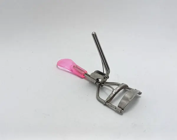 Isolated objects: Eyelash curler tool on white background