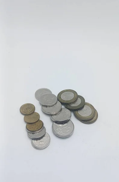 Jakarta, Indonesia - December 6, 2022: coins from Singapore, on white background, Jakarta, Indonesia