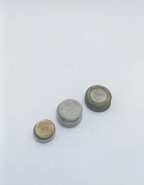Jakarta, Indonesia - December 6, 2022: coins from Singapore, on white background, Jakarta, Indonesia