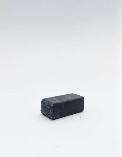 Isolated objects: Black pencil eraser, on white background