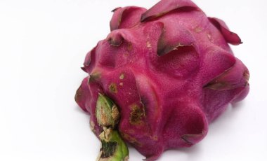 Isolated object: red skin of a dragon fruit cut in half, on a white background
