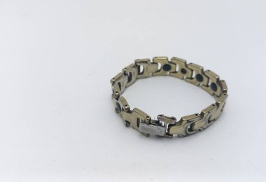 Isolated objects: magnetic bracelets are believed to relieve pain, on white background