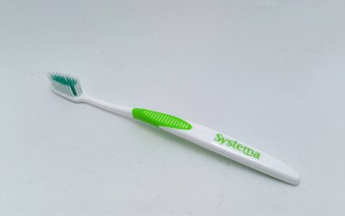Jakarta, Indonesia - December 15, 2022: Isolated objects: SYSTEMA Smart Clean Toothbrush is a toothbrush with Micro Clean technology, super soft bristles, on white background, Jakarta, Indonesia