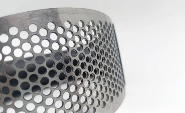 Isolated objects: stainless steel grater or garlic chopper with plastic handle, on white background