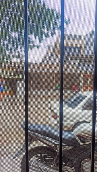 Jakarta, Indonesia - December 14, 2022: house doors with iron wire to keep mosquitoes from entering, Jakarta, Indonesia 