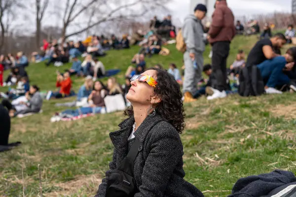 Toronto Canada April 2024 Woman Watching Beginning Partial Solar Eclipse Royalty Free Stock Photos