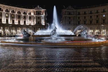 Rome, Italy - February 28, 2023: In the piazza della Repubblica the majestic fountain of the Naiads photographed at night with a long exposure.