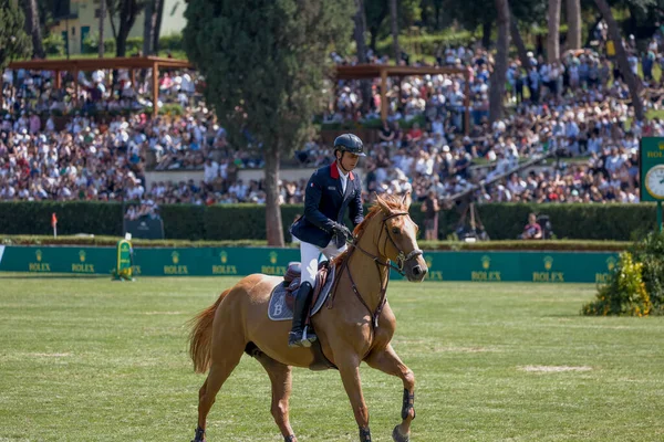 stock image Rome, Italy - 28th May, 2023: ROME ROLEX GRAND PRIX 2023 INTERNATIONAL, Equestrian jumping, Piazza di Siena. Second round, horse rider Julien Epaillard (FRA) in action on playground during competition.