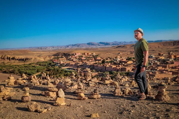 European tourist in Morocco, in the Atlas desert in Ait Ben Haddou.