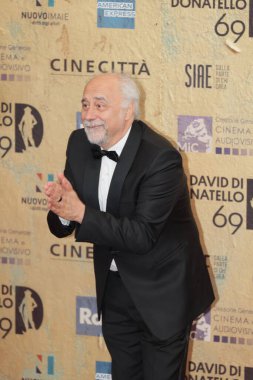 Rome, Italy - May 3, 2024: Giorgio Diritti attends the red carpet of the David di Donatello 2024 awards ceremony in Rome, Italy at Cinecitta Studios clipart
