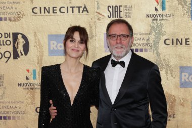 Rome, Italy - May 3, 2024: Valerio Mastandrea and Paola Cortellesi attend the red carpet of the David di Donatello 2024 awards ceremony in Rome, Italy at Cinecitta Studios. clipart