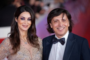 Rome, Italy - October 26: Manuela Arcuri and Anton Giulio Grande attend the red carpet during the 19th Rome International Film Festival at Auditorium Parco Della Musica. clipart