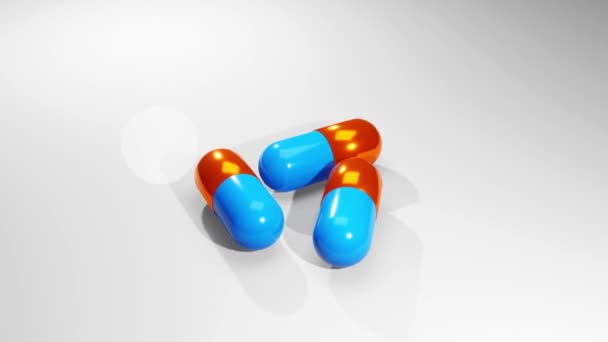 Drei Tabletten Liegen Auf Einer Weißen Oberfläche Mit Grauem Hintergrund — Stockvideo