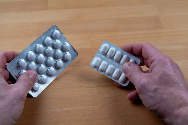 Hands with a blisters of medicine pills. High quality photo