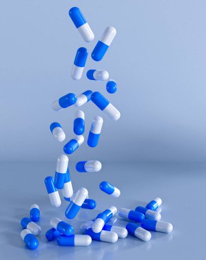 Tıbbi geçmiş, hapların, vitaminlerin, besleyici maddelerin kapsülleri açık bir ambalaj kavanozundan düşüyor.