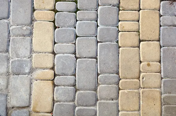 Taş yol dokusu. Çakıl taşı. Eski taş zemin dokusu, üst görünüm.