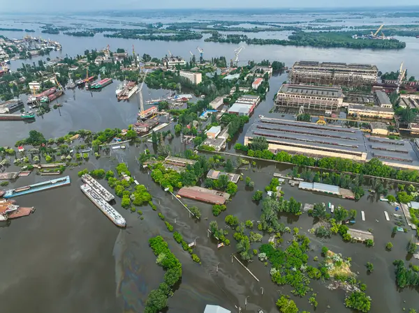 stock image Undermining the dam of the Kakhovka reservoir. Consequences of the dam blowing. Flooded port infrastructure of the city of Kherson. Top view from above, aerial footage. Russian-Ukrainian war