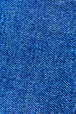 Mavi hippi kot pantolon kumaşı. Denim Kumaş dokusu arka planı. Doğal kumaşlar tekstil.