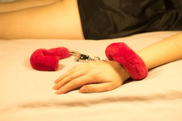 Woman Wearing Red Sexy Fluffy Handcuffs Her Wrists Bed — Stockfoto