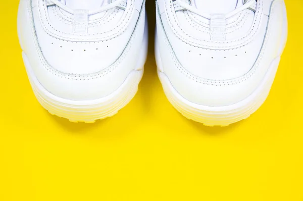 Modern Sneakers Yellow Background White Leather Trainers Big Sole Spikes — Zdjęcie stockowe