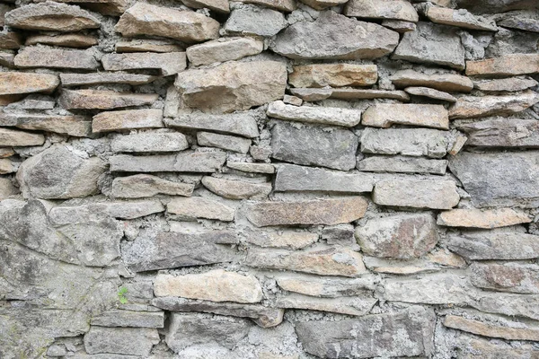 stock image Brick wall with stones. Texture background.