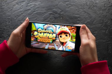 LVIV, UKRAINE - November 08, 2022 : Playing mobile game Subway Surfers on modern smartphone.