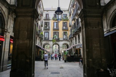 BARCELONA, SPAIN - OCTOBER 15, 2018: Spanish streets in Barcelona. Gothic square. City life. clipart