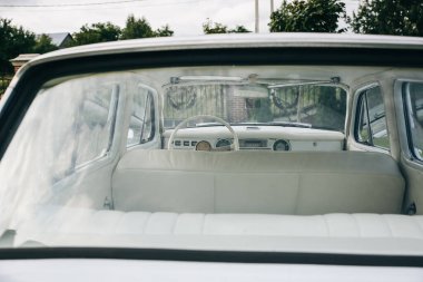 LVIV, UKRAINE - AUGUST  25, 2018 : Old retro car is standing outdoors. Vintage vehicle. Stylish concept automobile. clipart