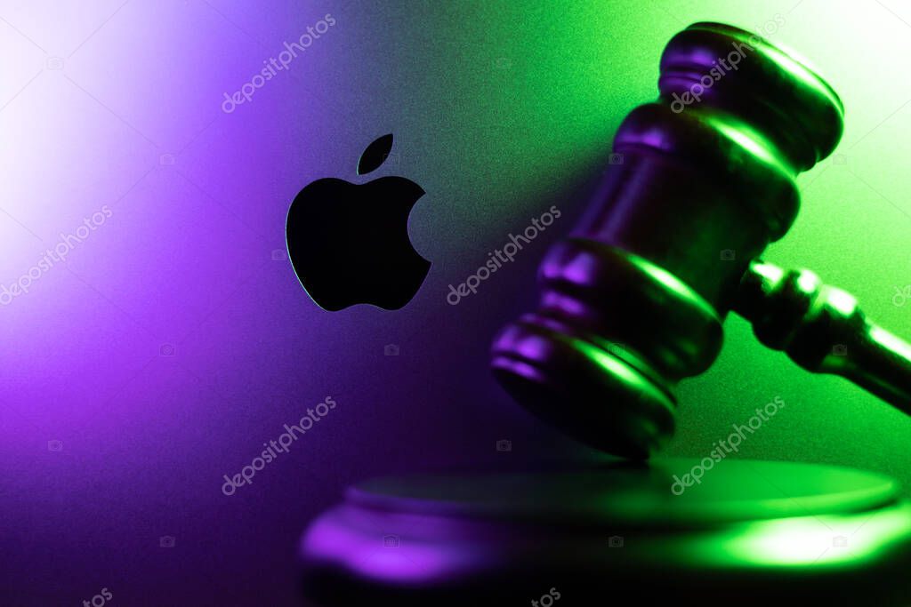 KYIV, UKRAINE - April 15, 2025 : Apple company logo and judge gavel. Law and justice concept. Court of law.