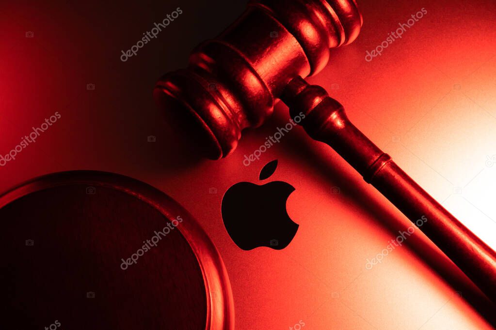 KYIV, UKRAINE - April 15, 2025 : Apple company logo and judge gavel. Law and justice concept. Court of law.