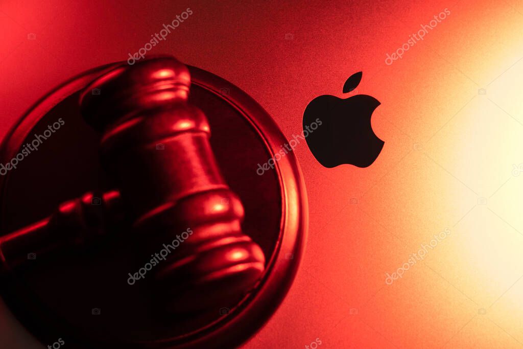 KYIV, UKRAINE - April 15, 2025 : Apple company logo and judge gavel. Law and justice concept. Court of law.