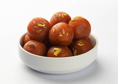 Indian sweet food Gulab Jamun served in a round bowl clipart