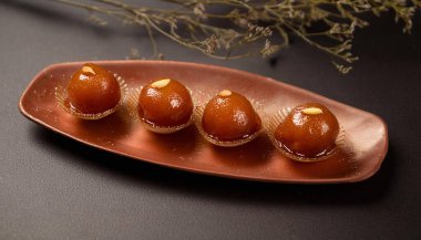 Gulab jaman with nuts syrup. Ai Generated clipart