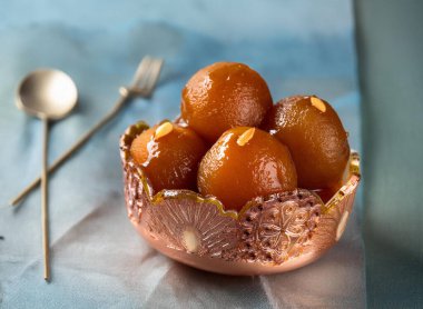 Gulab jaman with nuts syrup. Ai Generated clipart