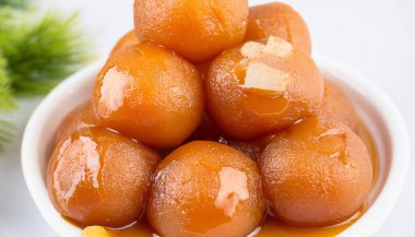 Gulab jaman with syrup. Ai Generated clipart