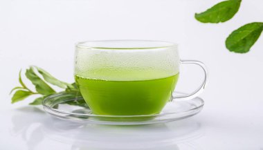 Cup with hot aromatic green tea on a Isolated background clipart