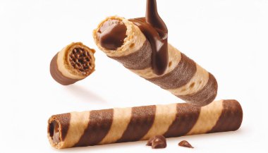 wafers Roll covered in chocolate inside on white background. clipart