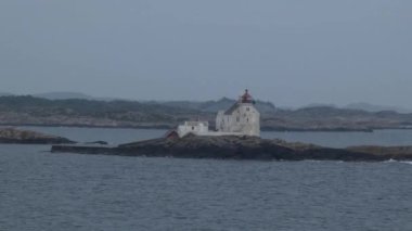 Lighthouse off the coast from ferry