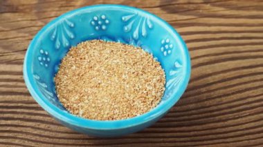 Dry organic lemon rind in ceramic bowl